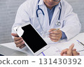 A doctor consulting and explain patient health check via digital tablet in office. Medicine and health care concept. 131430392