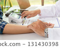 Doctor examining patient pulse by hands. Healthcare and medical service. 131430398