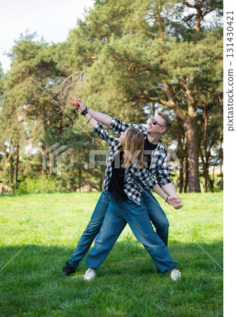 Happy Father And Daughter Look Outdoors, Having Fun And Dancing 131430421