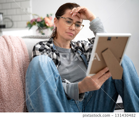 Girl Holding A Photo Frame Feeling Nostalgic And Sad About The Past, Feeling Nostalgic About The Past Creates A Sad Mood 131430482