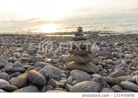Cairn made of pebbles on the sea shore. Cairn made of pebbles on the sea shore. 131430698