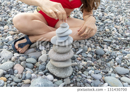 Cairn made of pebbles on the sea shore. 131430700