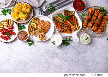 Assortment of grilled bbq meat and vegetables 131430930