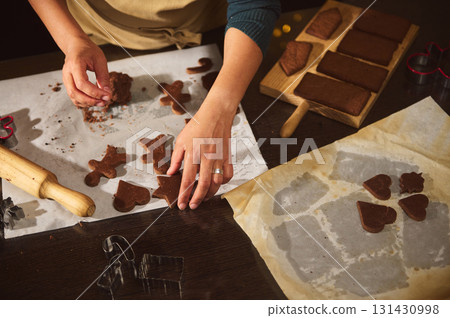 Handmade Gingerbread Cookies: Rolling, Cutting Shapes for Christmas Baking at Home 131430998