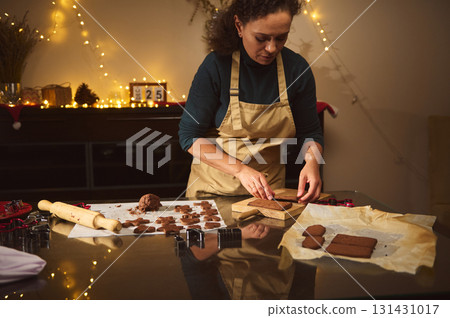 Decisive Moment Of Christmas Baking: Woman Preparing Cookies In Warm Cozy Kitchen Decisive Moment Of Christmas Baking: Woman Preparing Cookies In Warm Cozy Kitchen 131431017
