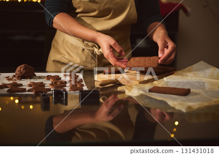 Cozy Kitchen Hands Preparing Brownies And Cookies On Wooden Board For Christmas 131431018
