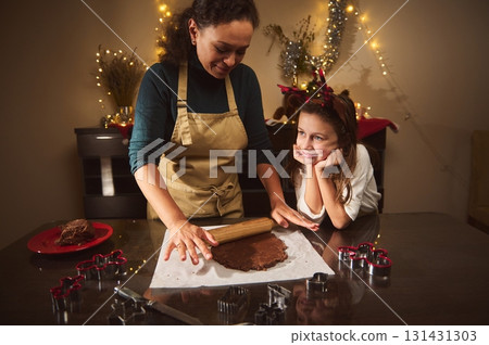 Mother And Child Bake Gingerbread Together For Christmas In A Cozy, Festive Kitchen 131431303
