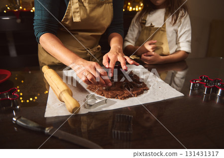 Family Baking Together: Mom And Child Cutting Gingerbread Cookies On The Table Family Baking Together: Mom And Child Cutting Gingerbread Cookies On The Table 131431317