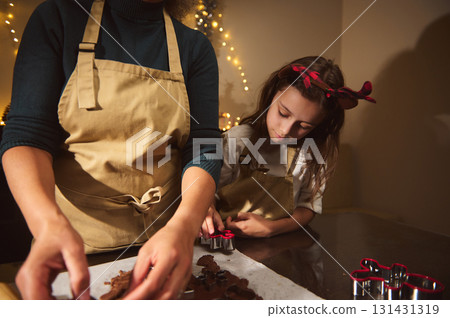 Family Christmas Baking Moment: Parent And Child Decorating Gingerbread Cookies Together Family Christmas Baking Moment: Parent And Child Decorating Gingerbread Cookies Together 131431319