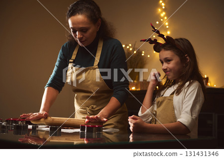 Mother And Daughter Bake Gingerbread Cookies Together In Cozy Christmas Kitchen Mother And Daughter Bake Gingerbread Cookies Together In Cozy Christmas Kitchen 131431346