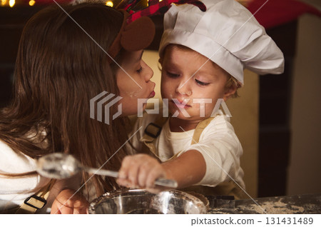 Mother And Child Baking Together In The Kitchen: Little Chef, Flour On Face, Cozy Moment 131431489