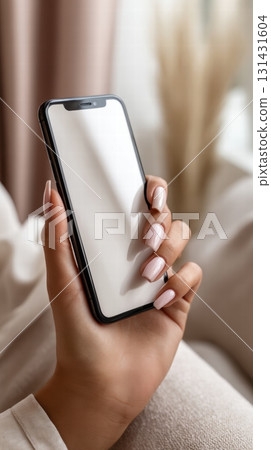 woman's hand holding black smartphone 131431604