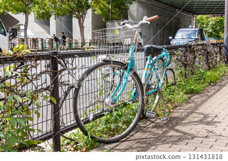Bicycles abandoned on the sidewalk 131431818