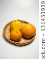 Oranges and grapefruit in a basket 131431939