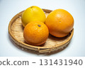 Oranges and grapefruit in a basket 131431940