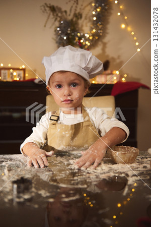 Young Little Chef Begins Festive Gingerbread Prep At Warm Home Kitchen During Christmas Young Little Chef Begins Festive Gingerbread Prep At Warm Home Kitchen During Christmas 131432078