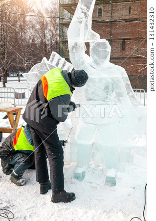 Vologda, Russia - February 15, 2025. Ice sculpture creation on the city's central square 131432310