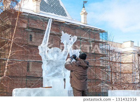 Vologda, Russia - February 15, 2025. Ice sculpture creation on the city's central square 131432316