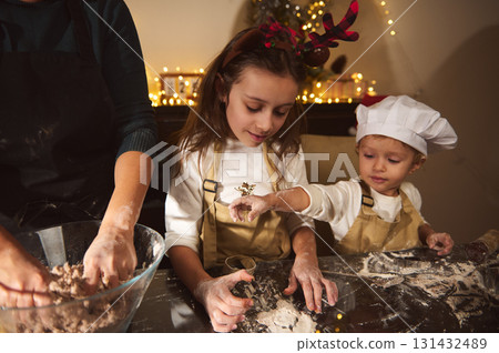 Family Christmas Baking With Kids In Cozy Home Kitchen, Holiday Lights, and Joyful Moments Family Christmas Baking With Kids In Cozy Home Kitchen, Holiday Lights, and Joyful Moments 131432489
