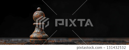 A vintage wooden chess pawn standing alone on a dark table, symbolizing strategy, competition, and intellectual games. 131432532