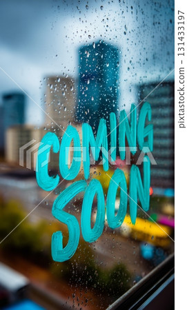 Teal painted COMING SOON text on rainy window with city skyline and drops 131433197