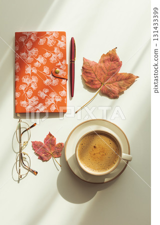 Autumn Flat Lay with Notebook, Coffee, Leaves and Eyeglasses Autumn Flat Lay with Notebook, Coffee, Leaves and Eyeglasses 131433399