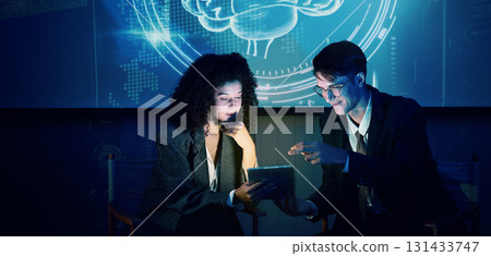 Business team discussing and using technology artificial intelligence with digital Ai assistant. Futuristic innovation AI technology collaboration and ideas for future. Business Tech Startup meeting. Business team discussing and using technology artificial intelligence with digital Ai assistant. Futuristic innovation AI technology collaboration and ideas for future. Business Tech Startup meeting. 131433747