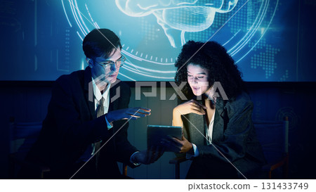 Business team discussing and using technology artificial intelligence with digital Ai assistant. Futuristic innovation AI technology collaboration and ideas for future. Business Tech Startup meeting. 131433749