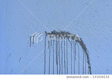 The coarse texture of a dark blue wall with a bold stain. The rough texture of a deep blue wall with an ink blot. The concept of background and textured surface. The coarse texture of a dark blue wall with a bold stain. The rough texture of a deep blue wall with an ink blot. The concept of background and textured surface. 131434133