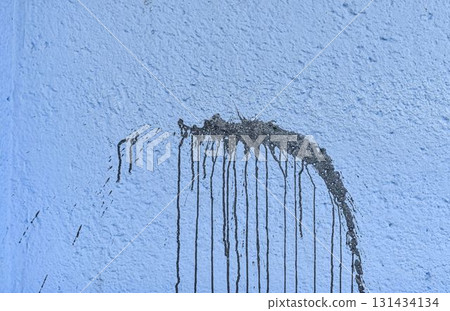 The coarse texture of a dark blue wall with a bold stain. The rough texture of a deep blue wall with an ink blot. The concept of background and textured surface. The coarse texture of a dark blue wall with a bold stain. The rough texture of a deep blue wall with an ink blot. The concept of background and textured surface. 131434134