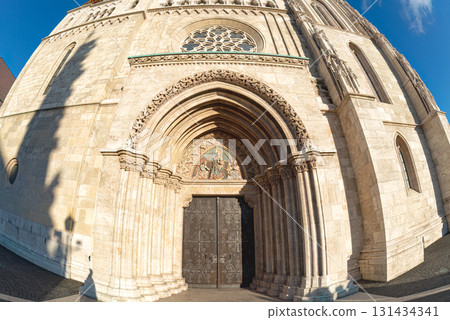 Matthias church main entrance showing detailed stone work and carvings in Budapest, Hungary Matthias church main entrance showing detailed stone work and carvings in Budapest, Hungary 131434341