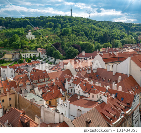 Panoramic view of Prague cityscape with red roofs and Petrin hill in the background. Czech Republic Panoramic view of Prague cityscape with red roofs and Petrin hill in the background. Czech Republic 131434353