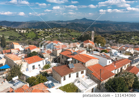 Kato Lefkara village houses with mountains and church bell tower. Cyprus 131434360