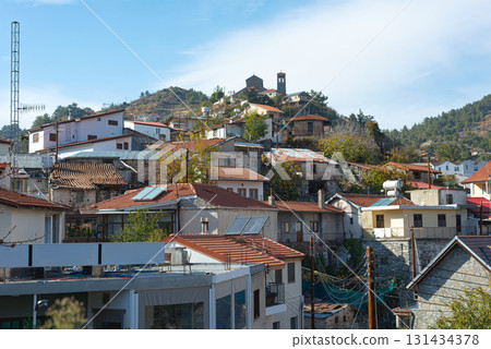 Traditional Kyperounta village houses climbing Troodos mountainside in Cyprus 131434378