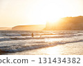 People swimming in Kourion beach waves at sunset. Episkopi, Limassol District, Cyprus 131434382