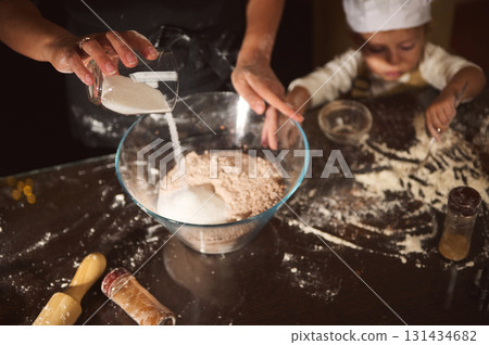 Family Baking Gingerbread With Mom And Kids: Mixing Flour For Christmas Treats Family Baking Gingerbread With Mom And Kids: Mixing Flour For Christmas Treats 131434682