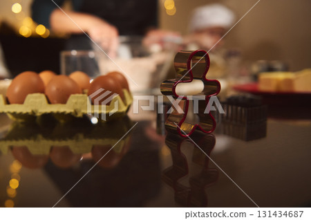 Family Christmas Baking Scene With Eggs, Gingerbread Cutter, And Cozy Kitchen Decor Family Christmas Baking Scene With Eggs, Gingerbread Cutter, And Cozy Kitchen Decor 131434687