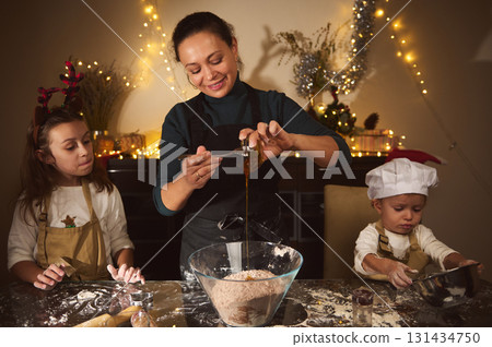Joyful Family Christmas Baking With Mom And Kids In Cozy Festive Kitchen 131434750