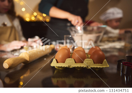 Cozy Kitchen Scene With Eggs, Rolling Pin, And Baking Activity During Christmas Preparations 131434751