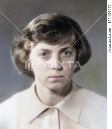 A vintage portrait of a sweet, serious fifteen-year-old girl near the start of a school year. Retro photo from 1975. A vintage portrait of a sweet, serious fifteen-year-old girl near the start of a school year. Retro photo from 1975. 131434983