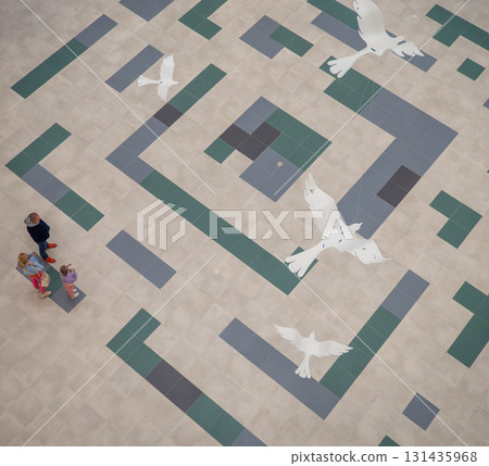 lobby of a new shopping center. Light walls of a shopping center. New Batumi Mall. A place to shop. Modern interior. Part of the interior. View from above lobby of a new shopping center. Light walls of a shopping center. New Batumi Mall. A place to shop. Modern interior. Part of the interior. View from above 131435968