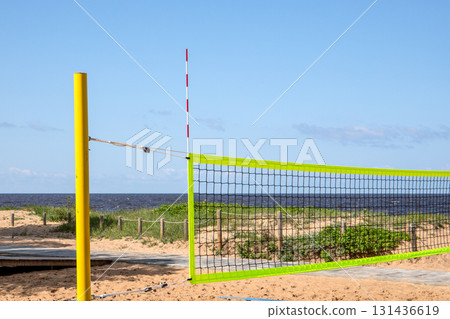 Empty Beach Volleyball Court on Sandy Shore by the Sea in Summer Empty Beach Volleyball Court on Sandy Shore by the Sea in Summer 131436619