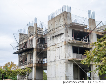 Abandoned construction site. Concrete frame of the building. Needs demolition. Crisis in the industry. Construction freeze. Abandoned construction site. Concrete frame of the building. Needs demolition. Crisis in the industry. Construction freeze. 131436746