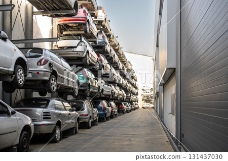 Stacked cars in scrapyard, rows of vehicles on 131437030