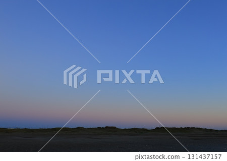 A sea stained in a morning glow 131437157