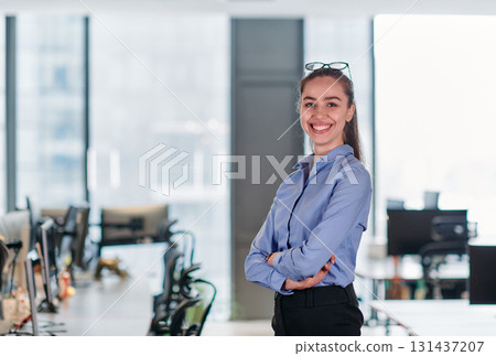 Confident Businesswoman: Blonde Executive Demonstrating Leadership with Crossed Arms. Confident Businesswoman: Blonde Executive Demonstrating Leadership with Crossed Arms. 131437207