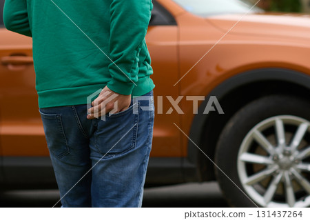 Close Up of a Man Retrieving His Phone from His Jeans Pocket. Close Up of a Man Retrieving His Phone from His Jeans Pocket. 131437264