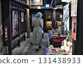 A woman walking in the city 131438933
