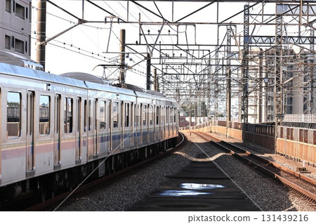 A Saikyo Line train leaving Kita-Yono Station A Saikyo Line train leaving Kita-Yono Station 131439216