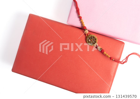 Colorful Rakhis and gift boxes are wrapped to celebrate the festival of sibling bond. 131439570
